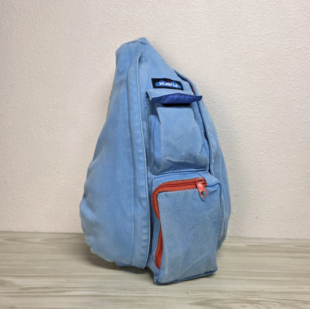 KAVU Denim Blue Sling Backpack with Orange Accents, Adjustable Rope Strap